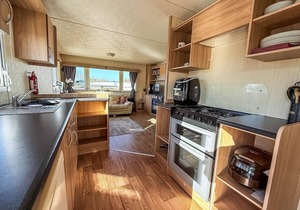 6 berth caravan for hire with decking at Manor Park in Norfolk ref 23017S