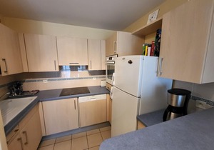 Coastal Haven: 2BR Apartment w/Mezzanine, Garage, Steps from Beach, Near Amenities