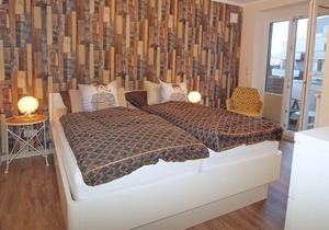 modern apartment right on the North Sea dike with a beach chair