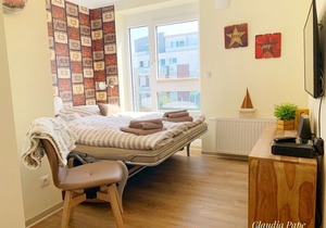 modern apartment right on the North Sea dike with a beach chair