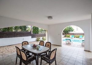 Picture Relaxing Beside Your Private Pool in Protaras Reading Your Favourite Book