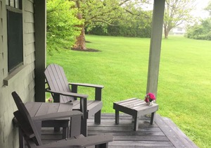 Sakonnet Point water view cottage with 8 minute walk to idyllic private beach .