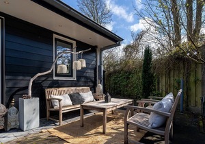 Spacious beach style holiday home with large garden and sauna.