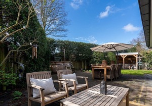 Spacious beach style holiday home with large garden and sauna.