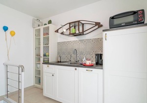 Step into a renovated vacation home built in 1800, located in a small coastal town 150 m from the ro