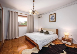 This Mediterranean vacation home with pool and beautifully landscaped garden is located in a settlem