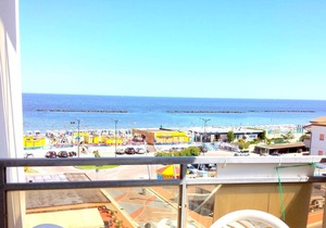 three-room apartment in a beachfront condo with a view of the pedestrian walkway