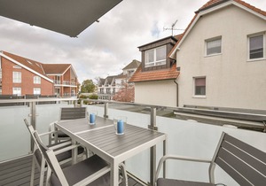 Vacation apartment Achtern Diek with balcony in the sun garden in Kellenhusen