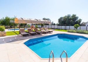 Villa with private pool and large balcony with sea view, ideal for families.