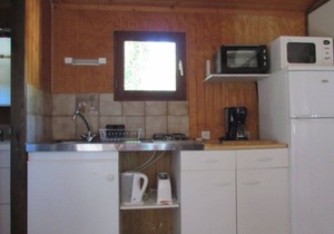 Wooden chalets in gite village with terrace, barbecue, swimming pool and air conditioning