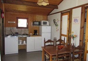 Wooden chalets in gite village with terrace, barbecue, swimming pool and air conditioning
