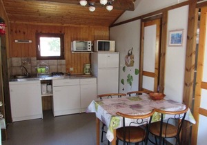 Wooden chalets in gite village with terrace, barbecue, swimming pool and air conditioning