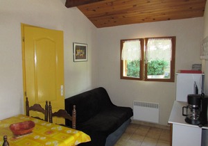 Wooden chalets in gite village with terrace, barbecue, swimming pool and air conditioning