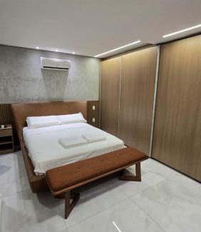 Castelo Apartment | 101 - Área Privativa de Luxo ar condicionado e churrasqueira
