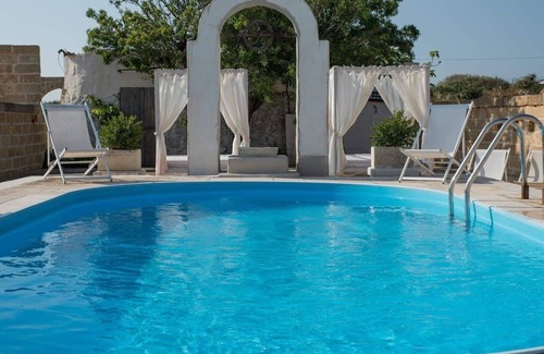 Corsano Villa | 1900 farm with swimming pool, yard, olive grove, fruit trees and views of the sea