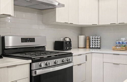 Sage Hill Apartment | 1BR Walk Out Suite » Backyard » Patio » 65” TV