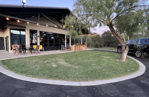 Graford House | 2 bed, 2 bath barndominium with pickle ball court, patio, & dock