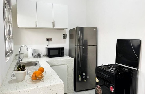 Entebbe Hotel | 2 Bedroom Apartment w/Palm View Balcony Ensuite Bathrooms Entebbe