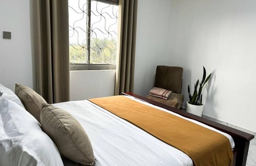 Entebbe Hotel | 2 Bedroom Apartment w/Palm View Balcony Ensuite Bathrooms Entebbe