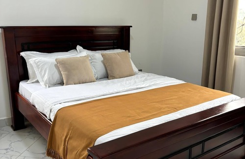 Entebbe Hotel | 2 Bedroom Apartment w/Palm View Balcony Ensuite Bathrooms Entebbe