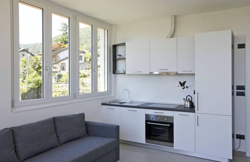 Comero Apartment | 2-bedroom corner apartment in a prestigious villa from 1850 with solar-heated pool