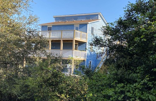 Carova Beach House | 2 Free beach parking passes! Waterfront Hot Tub Boat dock Pet friendly 360 Decks