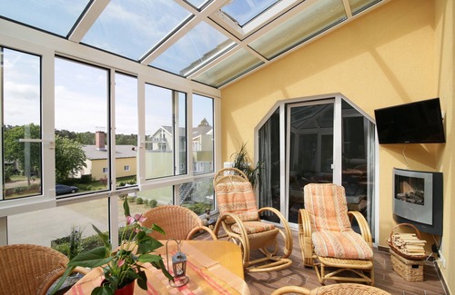Graal Mueritz Apartment | 2-room apartment with large conservatory with fireplace in the attic