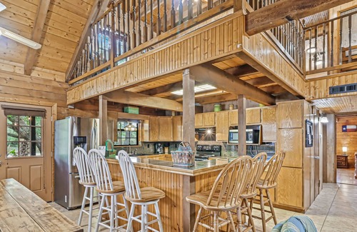 Rockport Cabin | 2-story cabin with an enclosed yard, patio, and large shade trees