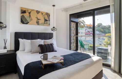 Centro Apartment | 2BR Apt w/ Balcony | Rooftop+FirePit+Gym+Lounge