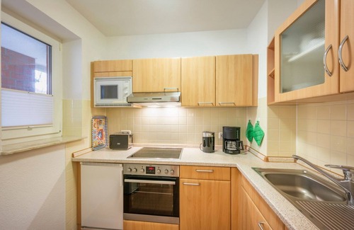 Schillig Apartment | 3-room apartment close to the beach with balcony and located directly on the North Sea dike