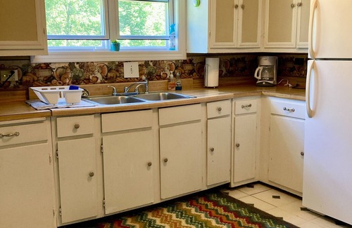 Manistique Cottage | 3BR/1.5BA Woodsy Stone Cottage 1 Hr to Pictured Rocks, Hike Trails On-Property