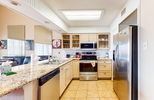 El Lago Condo | 3rd-floor condo with water views, on-site pool, & private balcony