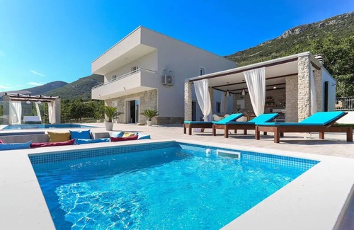 Kastel Stari House | 4 bedroom villa with heated pool, sea view and gym close to Split and Trogir.