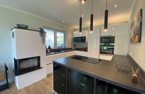 Pouch House | 8P Holiday home "Seegelblick" in the first row of the lake with sauna, fireplace & wallbox