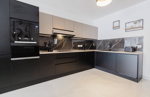 Qawra Apartment | A bright and spacious 2-bedroom apartment in Qawra with a large balcony, modern kitchen, and cozy bedrooms — the perfect base for a relaxing stay by the sea.
