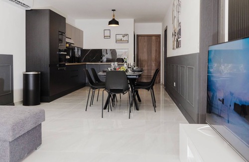 Qawra Apartment | A bright and spacious 2-bedroom apartment in Qawra with a large balcony, modern kitchen, and cozy bedrooms — the perfect base for a relaxing stay by the sea.
