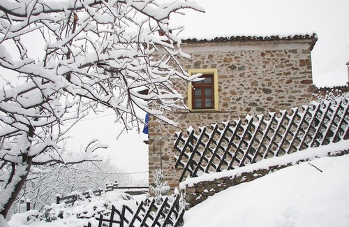 Sidirochori Villa | A century old stone House Overlooking The Kastoria Lake
