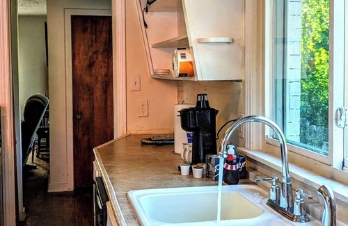 Pottawattamie Park House | A cozy little house along Trail Creek awaits you. Relax. Unwind. Enjoy.