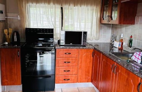 Gaborone Apartment | A Cozy Secure 2-Bed Apartment with a lovely garden