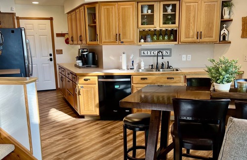 Cokato Cabin | A Creek Runs Through It & Garage Great Room