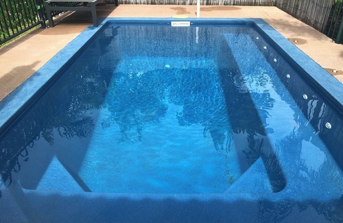 Marrara Apartment | A game of Golf, stroll home & relax with a glass of wine & a refreshing swim