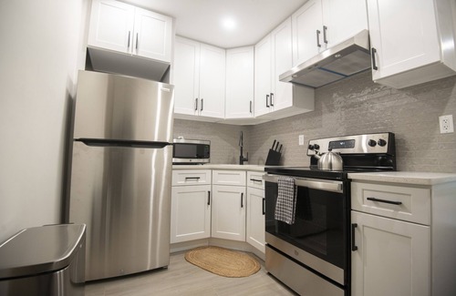 Queens Apartment | A Gem in the Heart of Queens: 2 Bed + 2 Bath with Large Backyard