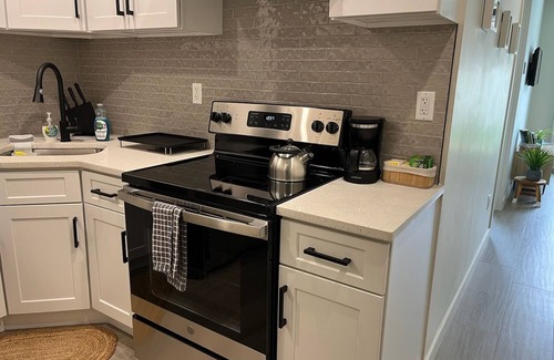 Queens Apartment | A Gem in the Heart of Queens: 2 Bed + 2 Bath with Large Backyard