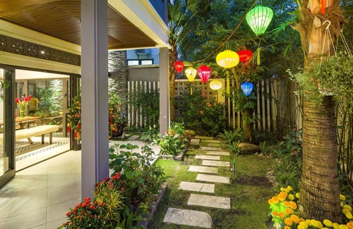 Cam An Villa | A hidden oasis villa along a narrow path 50 paces from white sand beach.