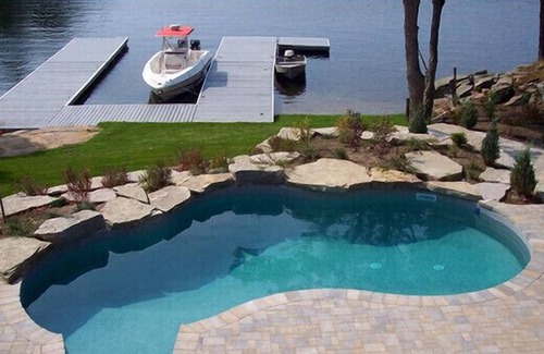 Georgian Bay House | A luxurious villa nestled along the bay upon a rock , breathtaking sunset views