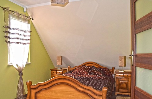 Lubna House | A luxury home on the shore of the lake. Living room with fireplace, 2 bedrooms.