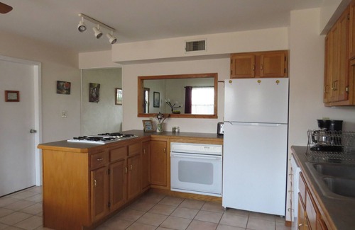 Miramiguoa Park House | A nice view of the woods awaits you from the countryside kitchen window and deck