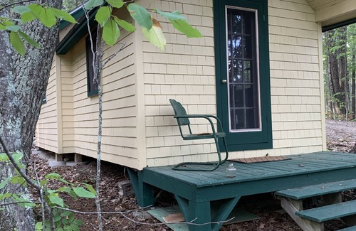 Belgrade Cabin | a relaxing guest house in the woods on a Lake