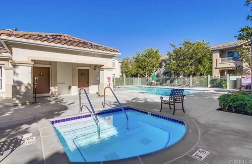 Sabre Springs Condo | A room wt a queen bed and room with 2 twin beds; an attached,interior bathroom.
