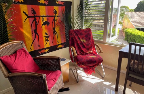 Santa Rosa Condo | A small mansion with a large swimming pool in a botanical garden